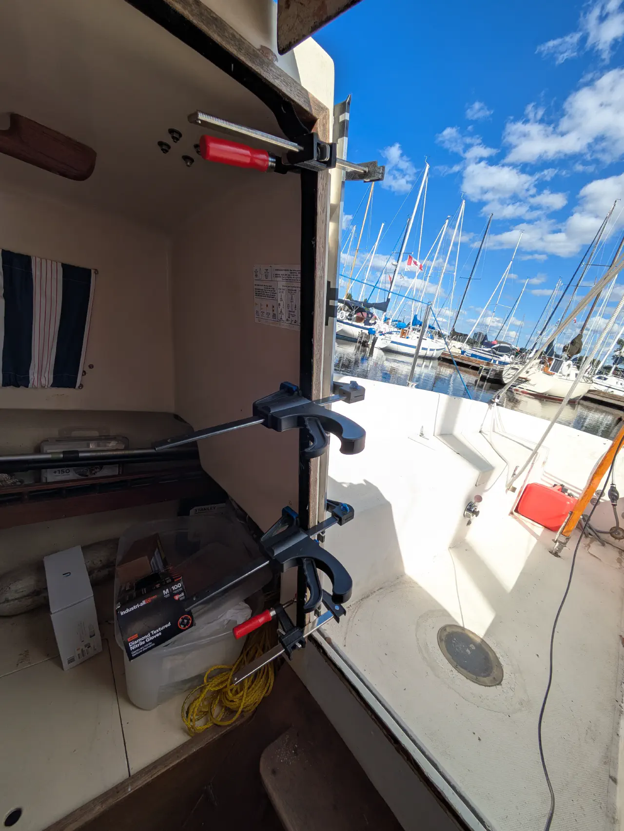 A series of clamps seen from the inside of the companionway