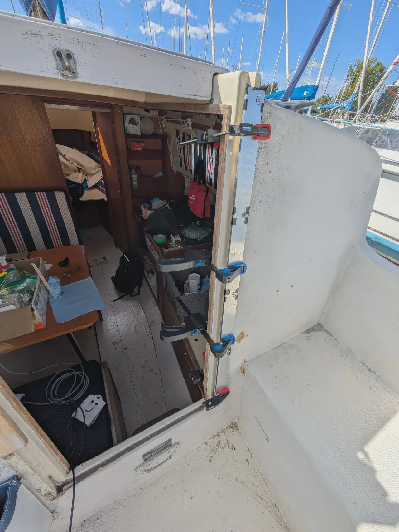 A series of clamps seen from the inside of the companionway